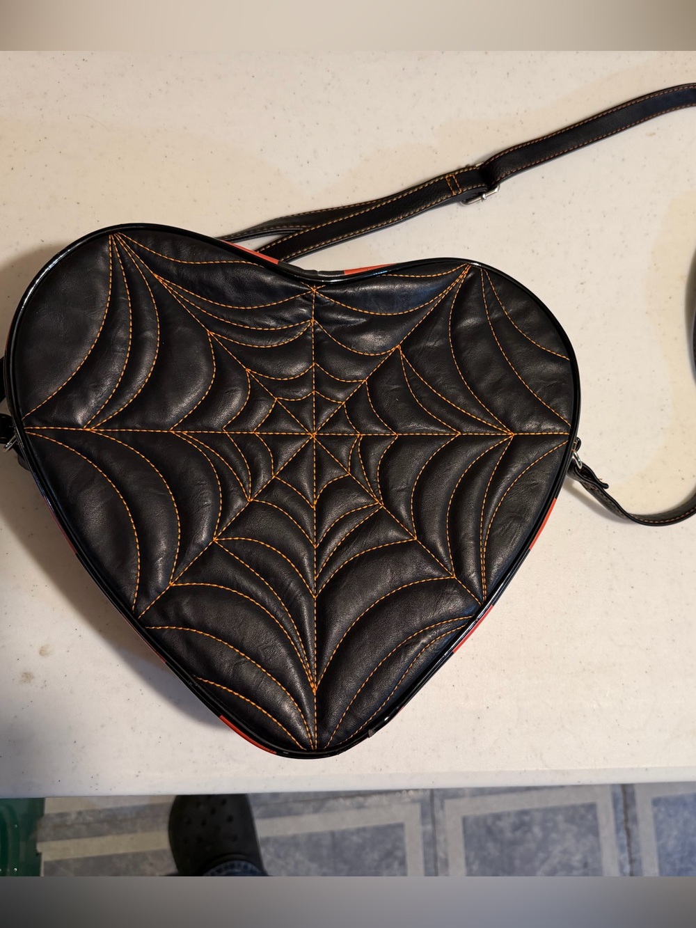 Black Heart-Shaped Crossbody Bag with Orange Stitching
